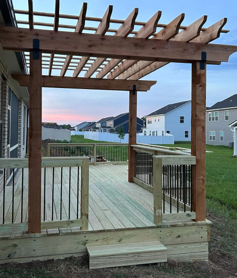 a newly installed deck with pergola